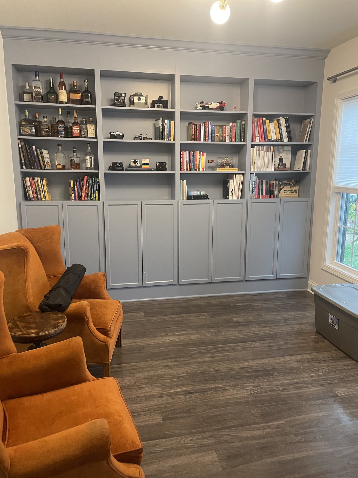 Custom gray built-in bookcase and cabinetry in a home study